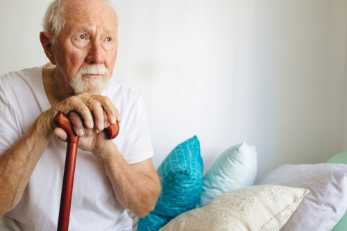 Dunedin Man Peering With Wooden Cane