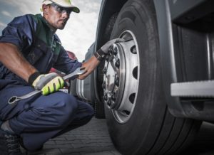 mechanic repairing truck after an accident