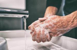 washing hands - COVID-19/ Understanding Commercial Insurance Policies That May Cover Your Business Loss and Interruption - Dolman Law Group Accident Injury Lawyers, PA